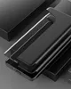 A black phone case is shown on a dark gray background. Produktbild-Vorschau
