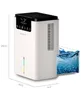 A white dehumidifier with a digital display and a clear water tank filled with blue water is shown against a white background. Náhled obrázku produktu