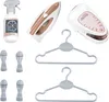 A collection of toy laundry accessories, including a spray bottle, iron, steam station, and hangers, arranged on a white background. Produktbild-Vorschau
