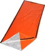 An orange and silver emergency bivvy bag is laid out on a white background. Podgląd zdjęcia produktu