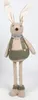 A stuffed bunny toy standing against a white background. Voir les images du produit