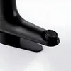 A close-up view of a black faucet's aerator. Náhľad obrázku produktu