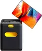A black and yellow portable projector with a colorful abstract image displayed on its screen. Náhľad obrázku produktu