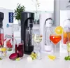 A display of soda makers and beverages on a countertop. Podgląd zdjęcia produktu