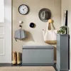 An entryway with a shoe cabinet, bench, clock, hat, and umbrella. Náhled obrázku produktu