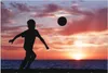 Wallario Wandbild Fußball - Kleiner Junge spielt im Produktbild-Vorschau 1