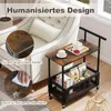 A serving cart with food and drinks next to a sofa. Anteprima dell’immagine prodotto
