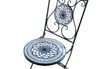 A close-up studio shot of a decorative chair with mosaic-style patterns on the seat and backrest. Produktbild-Vorschau