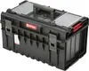 A black Qbrick System tool box with red accents and clear organizer lids. Náhled obrázku produktu