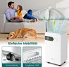 A couple and their dog relaxing on a couch with a white air purifier in the foreground. Náhled obrázku produktu