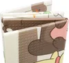 A close-up view of a folded baby play mat with cartoon animal illustrations. Produktbild-Vorschau