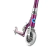 A close-up, low-angle shot of the front wheel and deck of a purple Micro Scooter, isolated on a white background. Produktbild-Vorschau