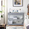 A console table with decorative items and books in a room setting. Produktbild-Vorschau