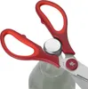 A close-up shot of red-handled kitchen scissors opening a bottle cap. Produktbild-Vorschau