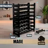 A black plastic wine rack is shown in a room setting, with dimensions and capacity indicated by text overlays. Produktbild-Vorschau