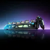 A futuristic-looking mechanical keyboard with neon-like lighting and a unique design, displayed on a reflective surface with a gradient background. Anteprima dell’immagine prodotto