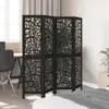 A room divider is placed in a bedroom setting, next to a bed and a desk with a chair. Voir les images du produit