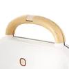 Close-up of a white appliance with a wooden handle. Podgląd zdjęcia produktu