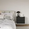 A modern bedroom scene featuring a bed and a nightstand. Anteprima dell’immagine prodotto