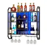 A wall-mounted wine rack with multiple shelves and LED lighting, filled with various bottles of alcohol and wine glasses. Produktbild-Vorschau