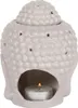 A Buddha head-shaped oil burner with a lit tea light inside. Anteprima dell’immagine prodotto