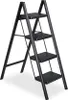 A black four-step folding ladder is shown against a white background. Produktbild-Vorschau