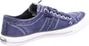 A side view of a blue canvas sneaker with white stitching and a white sole. Voir les images du produit