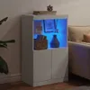 A white sideboard with blue LED lighting is displayed in a living room setting, next to a sofa and a plant. Voir les images du produit