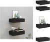 Two black floating shelves mounted on a light gray wall, decorated with various items. Náhled obrázku produktu