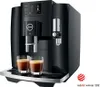 A black JURA coffee machine with two glasses of espresso in front of it, on a white background. A red dot award badge is in the bottom right corner. Anteprima dell’immagine prodotto