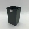 A dark gray trash can with a label on it, set against a white background. Produktbild-Vorschau