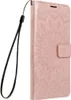 A rose gold colored phone case with a mandala pattern, shown from the side with a wrist strap attached. Produktbild-Vorschau