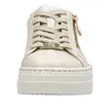 A close-up front view of a beige platform sneaker with gold accents. Náhled obrázku produktu