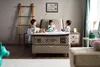 Children playing on a boxspring bed in a bedroom setting. Produktbild-Vorschau