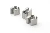 Three silver metal door hinges are arranged diagonally on a white background. Produktbild-Vorschau
