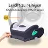 A child's car seat booster is shown in front of a washing machine, with text indicating it is easy to clean and machine washable. Produktbild-Vorschau
