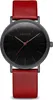 A close-up, front-facing studio shot of a Bering watch with a black face and red leather strap. Produktbild-Vorschau