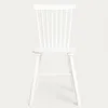 A white wooden chair with a spindle back is shown from the front against a plain white background. Produktbild-Vorschau
