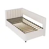A beige upholstered bed frame with a slatted mattress base, shown from a diagonal angle against a white background. Voir les images du produit