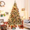 A decorated Christmas tree with presents underneath, in a cozy room setting. Produktbild-Vorschau