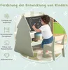 A young child is drawing on a blackboard easel with a chair. Náhľad obrázku produktu