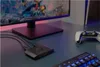 A gaming setup with a monitor, keyboard, controller, and capture card. Náhled obrázku produktu