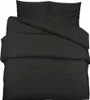 A black duvet cover and pillow set laid out on a white background. Náhľad obrázku produktu