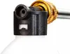 Close-up of the top of a white bottle with a black plastic attachment and a gold metal fitting. Náhled obrázku produktu
