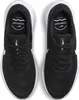 A top-down view of a pair of black Nike running shoes with white soles and white Nike logos. Voir les images du produit