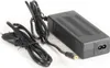 A black power adapter with two cables, one with a European plug and the other with a connector, is laid out on a white background. Náhled obrázku produktu