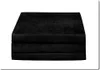 A stack of black folded mattresses. Produktbild-Vorschau