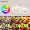 A modern LED ceiling light with two rings, shown with a color rendering index (CRI) demonstration using fruit. Podgląd zdjęcia produktu