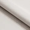 A close-up view of a folded piece of light-colored fabric, likely upholstery or bedding. Náhled obrázku produktu