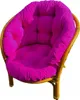 A close-up studio shot of a fuchsia cushion on a rattan chair. Produktbild-Vorschau